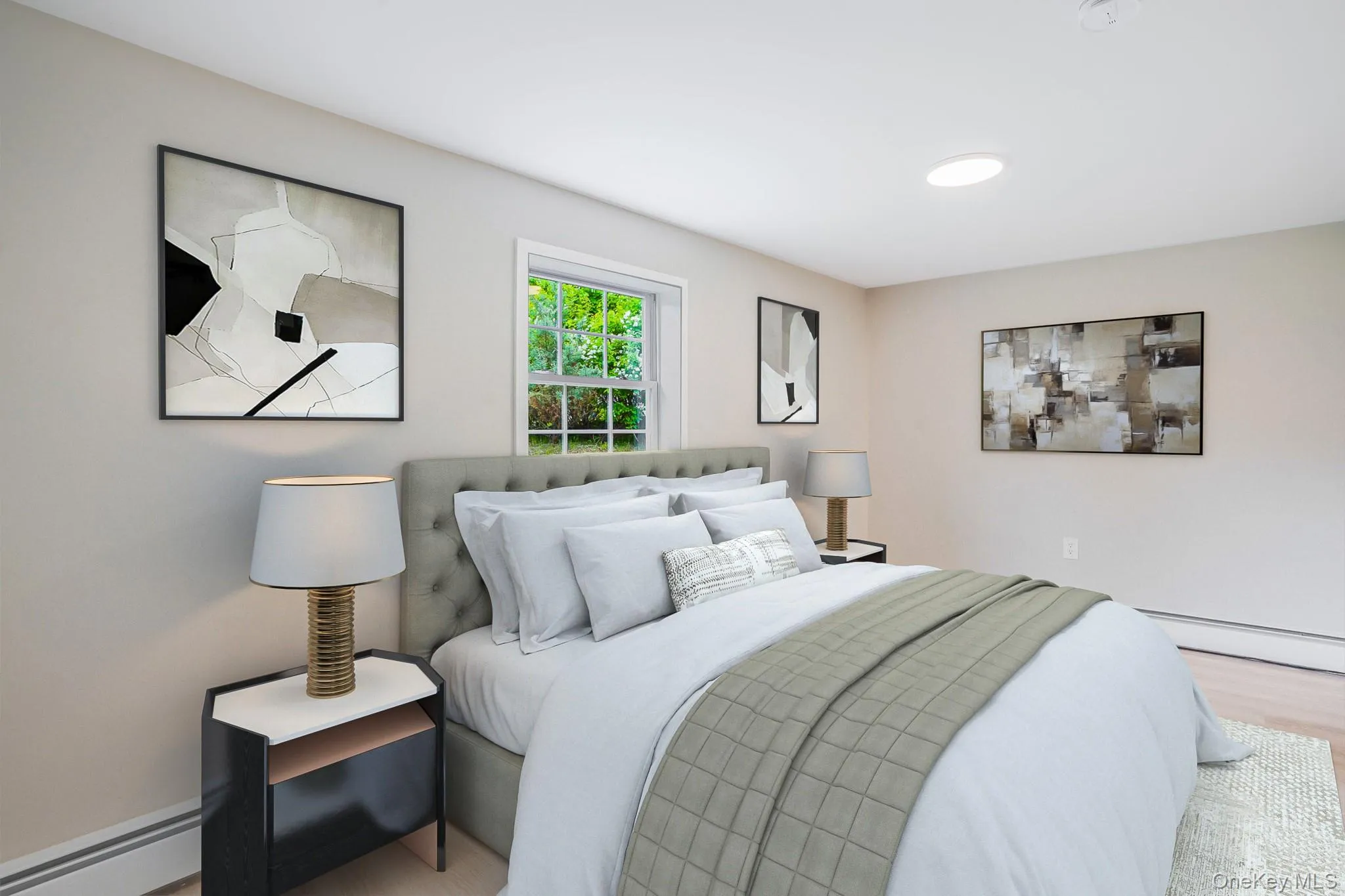 Bedroom featuring light-tone wood-finish flooring, a window with exterior views, and a ceiling-mounted light fixture Bedroom featuring light-tone wood-finish flooring, a window with exterior views, and a ceiling-mounted light fixture