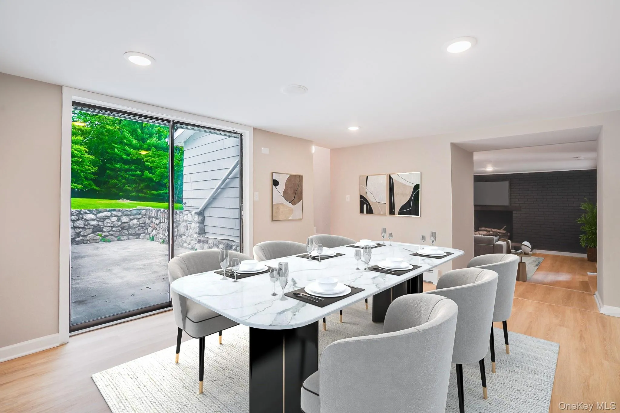 Dining area with wood-finish flooring and recessed lighting Dining area with wood-finish flooring and recessed lighting