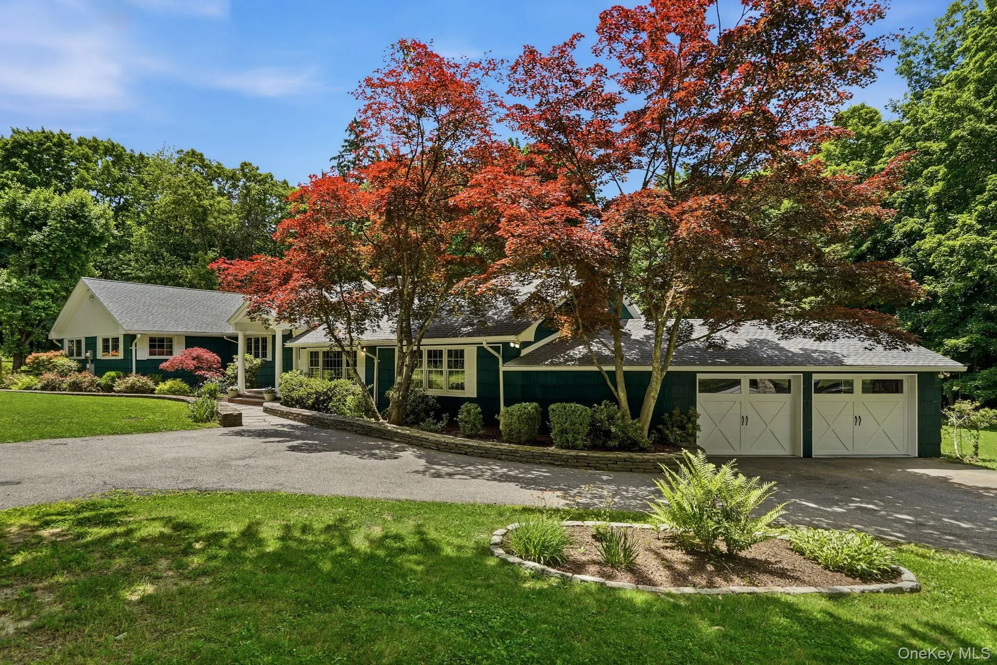Circular driveway showing two car garage. Circular driveway showing two car garage.