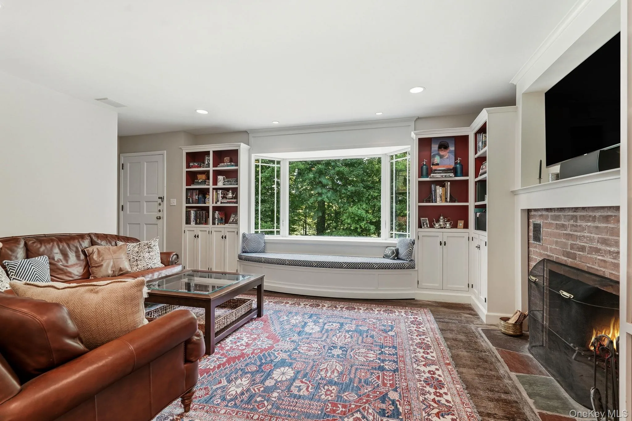 Family room with window seat overlooking the grounds. Family room with window seat overlooking the grounds.