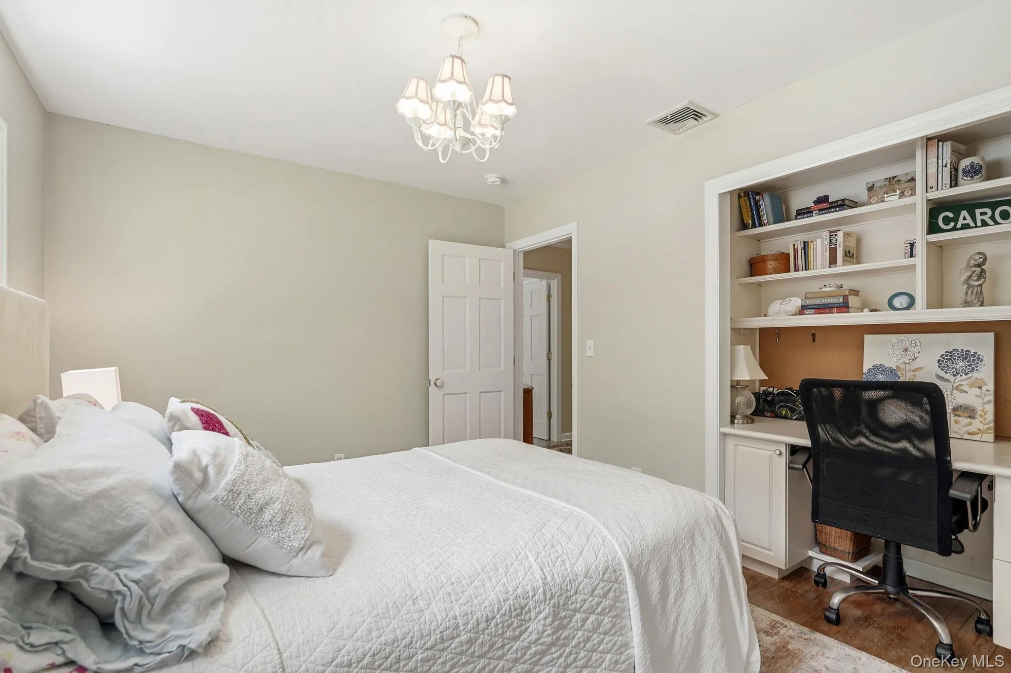 Second bedroom with custom built in desk. Second bedroom with custom built in desk.