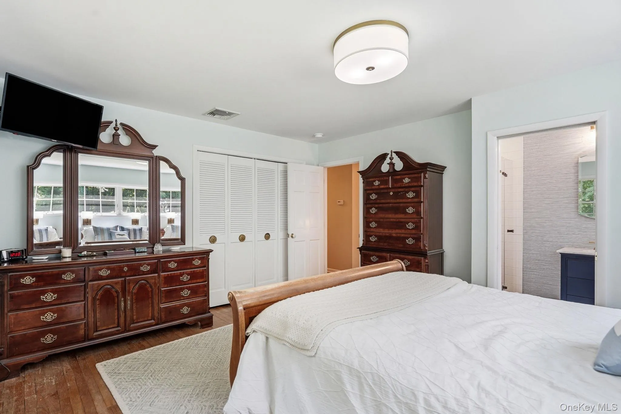 Another angle of primary bedroom showing doors to the walk in closets. Another angle of primary bedroom showing doors to the walk in closets.