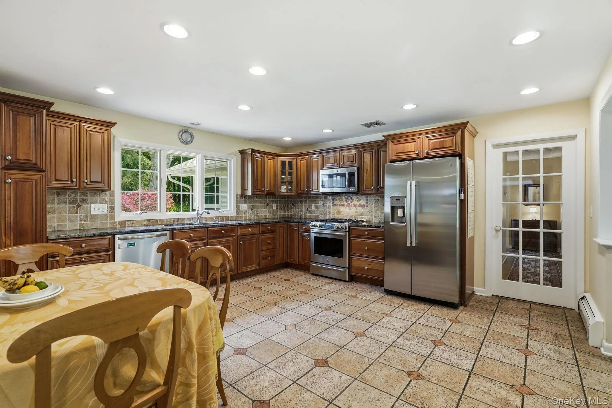 Eat in kitchen with glass door to hallway leading to the bedrooms. Eat in kitchen with glass door to hallway leading to the bedrooms.