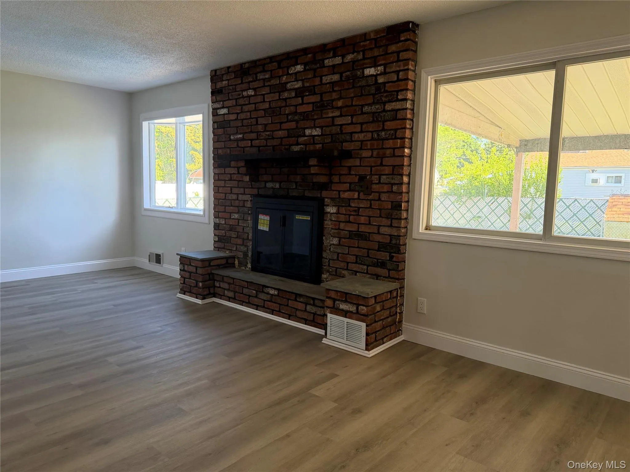 Beautiful fireplace in the possible 1st floor bedroom with proper permits Beautiful fireplace in the possible 1st floor bedroom with proper permits