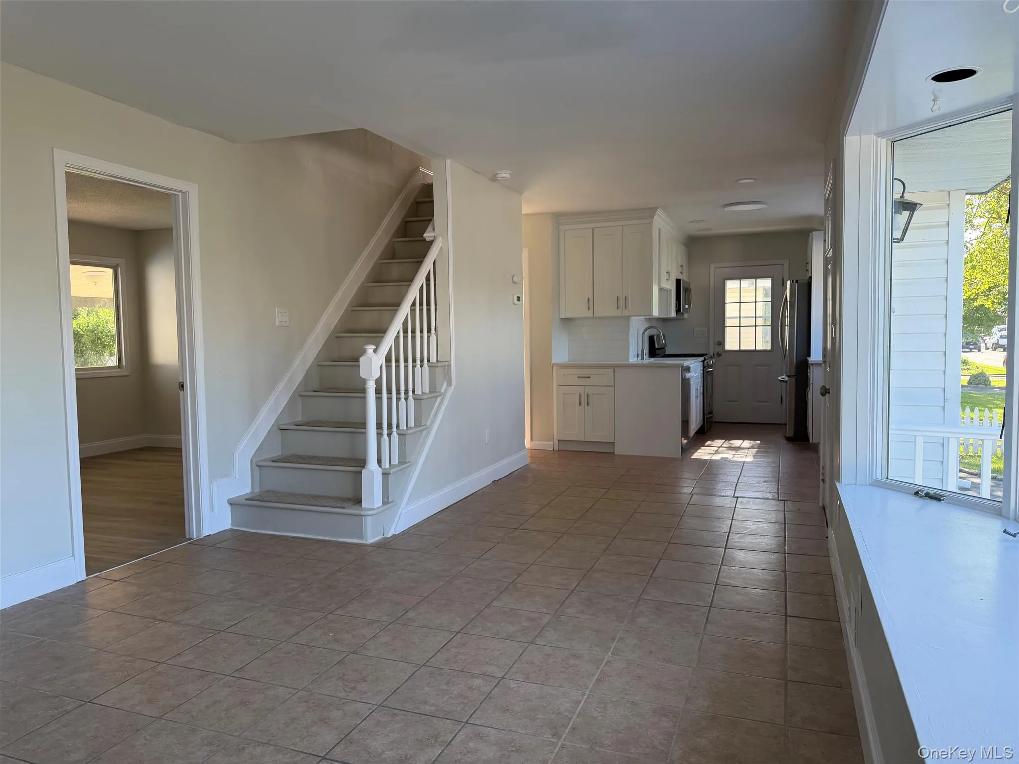 Kitchen w/outside entrance and hall way to full bath on first floor . Stair case to upstairs. ( Entrance to Livingrm or possible bedrm w/proper permits Kitchen w/outside entrance and hall way to full bath on first floor . Stair case to upstairs. ( Entrance to Livingrm or possible bedrm w/proper permits