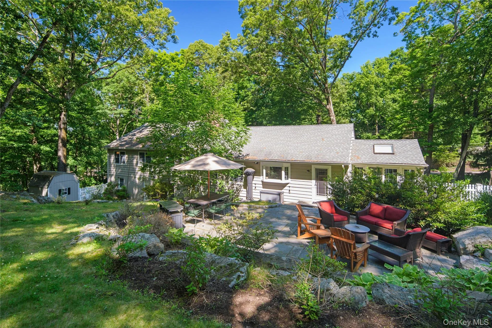 The bilevel bluestone patio with firepit is accessible from the main living level and finished lower level The bilevel bluestone patio with firepit is accessible from the main living level and finished lower level