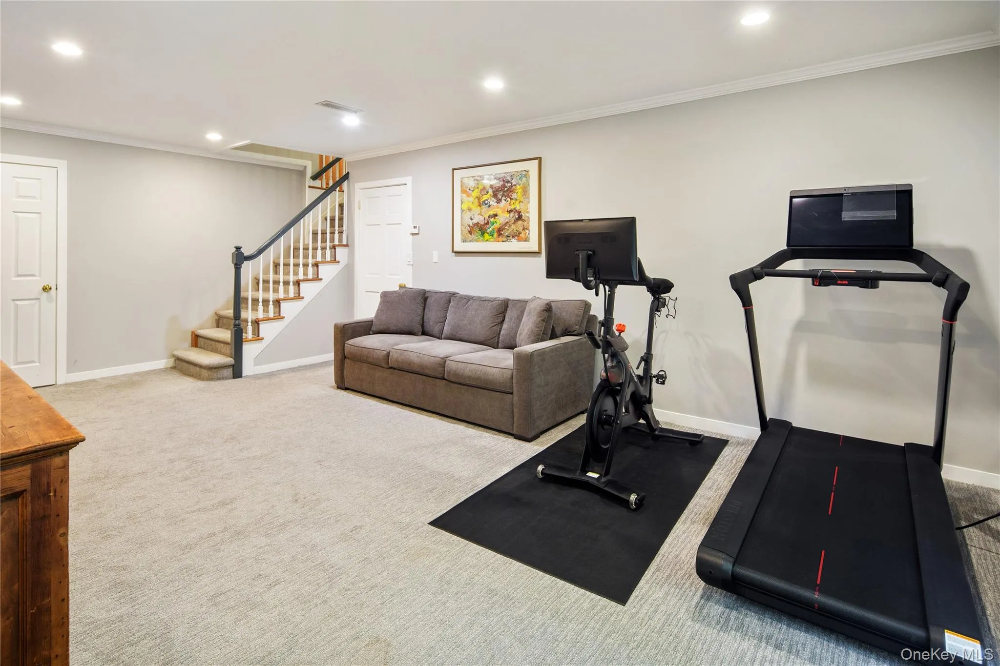 The lower level offers a large playroom/rec room with crown molding, recessed lighting and sliding glass doors to the lower patio, a home office, powder room and storage/mechanical room, a large fully outfitted mudroom and generous sized two car garage. The lower level offers a large playroom/rec room with crown molding, recessed lighting and sliding glass doors to the lower patio, a home office, powder room and storage/mechanical room, a large fully outfitted mudroom and generous sized two car garage.