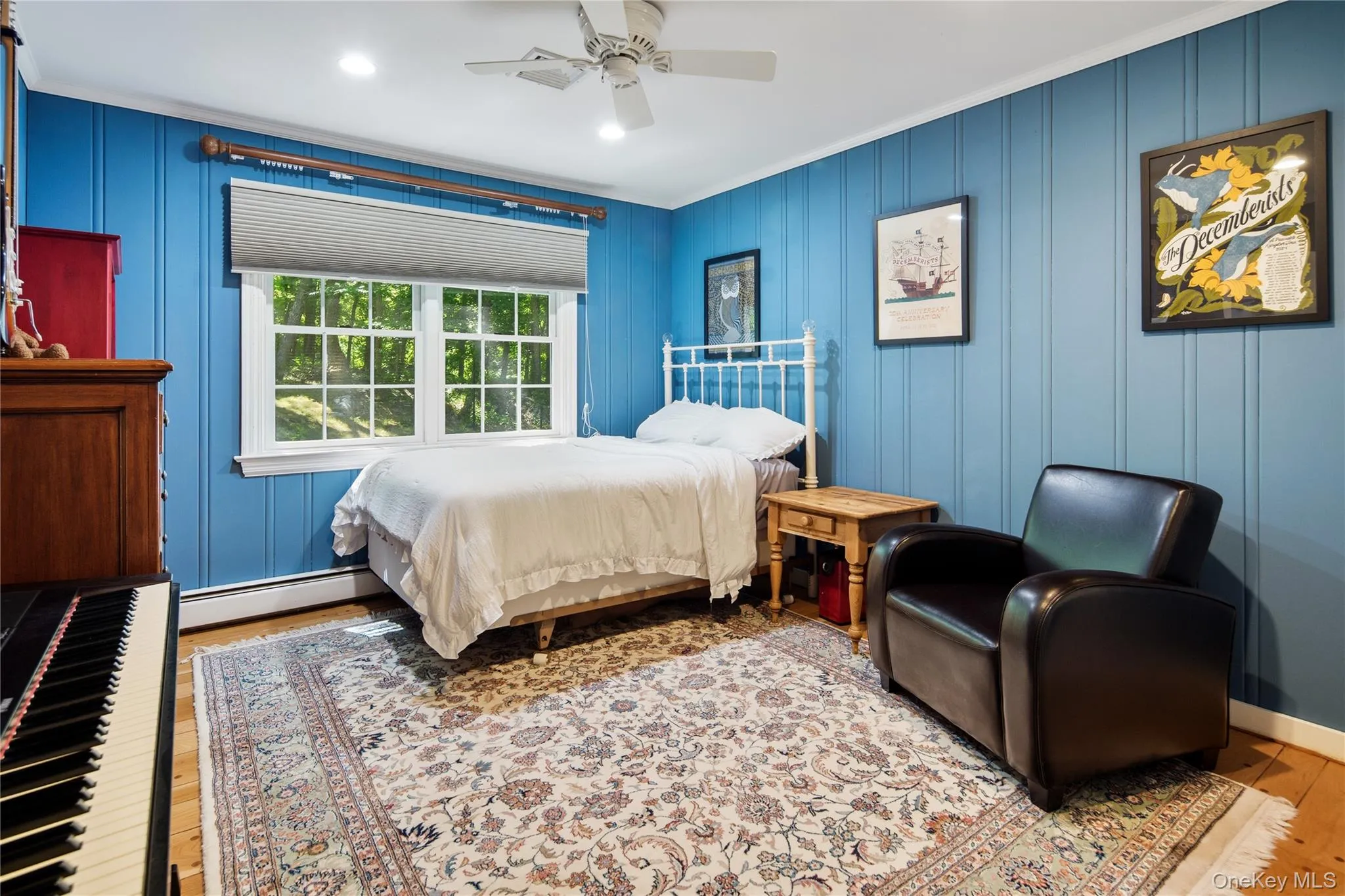 Bedroom 3 has tongue and groove wood wall paneling, wide board peg oak floors, crown molding, recessed lighting, double closet and a ceiling fan Bedroom 3 has tongue and groove wood wall paneling, wide board peg oak floors, crown molding, recessed lighting, double closet and a ceiling fan