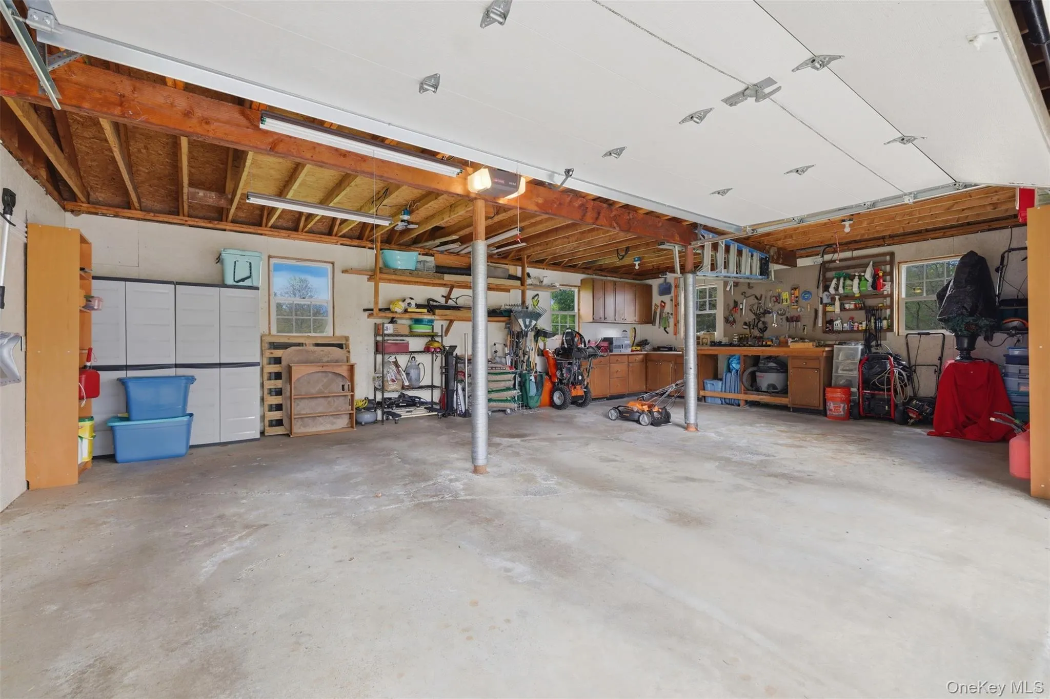 Inside oversized 2 car garage with storage above Inside oversized 2 car garage with storage above