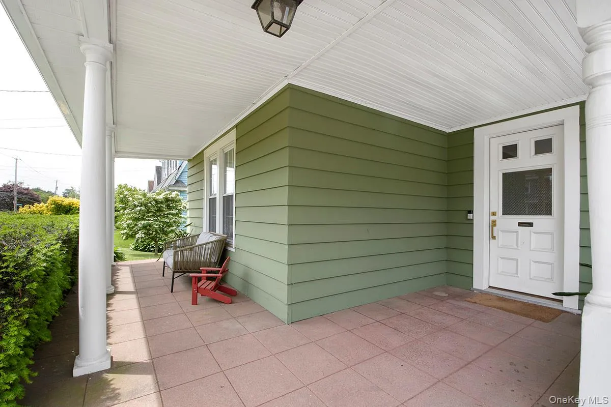 Property entrance featuring covered porch Property entrance featuring covered porch