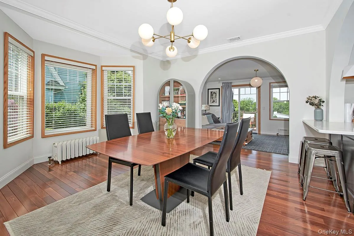 Dining room with arched opening to living room Dining room with arched opening to living room