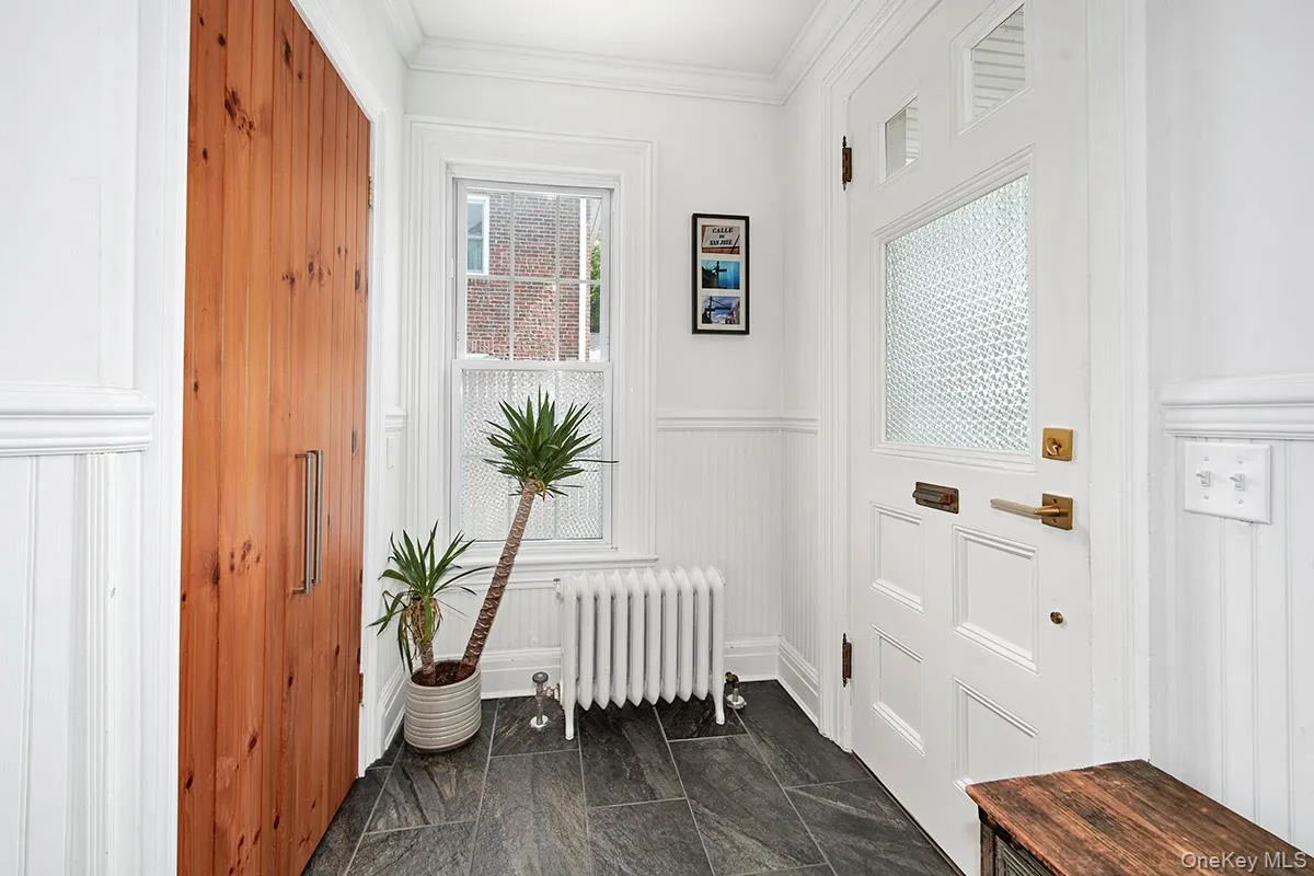 Doorway to outside, crown molding, a wainscoted wall, Doorway to outside, crown molding, a wainscoted wall,