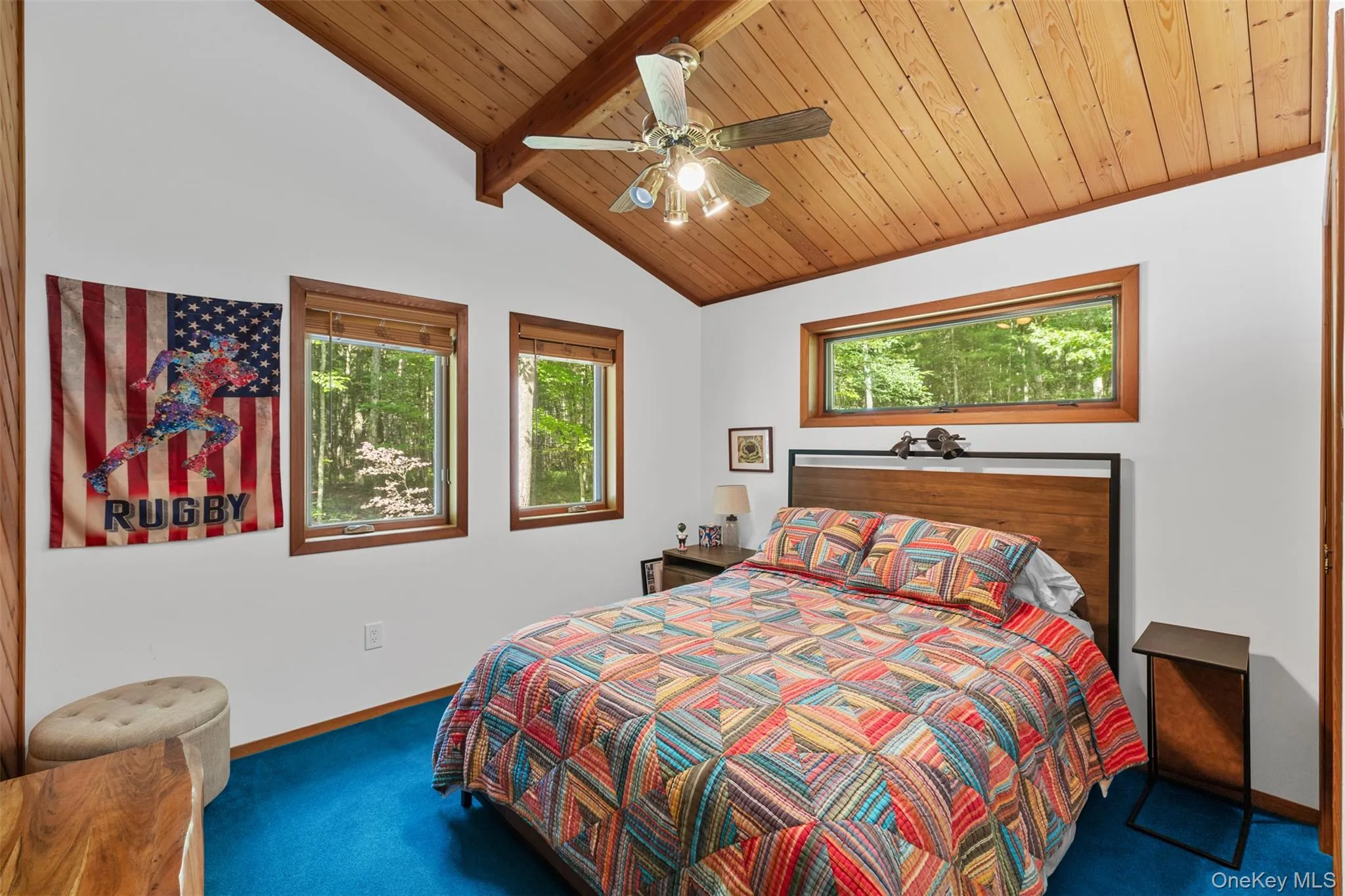Bedroom with carpet flooring, wood ceiling, and ceiling fan Bedroom with carpet flooring, wood ceiling, and ceiling fan