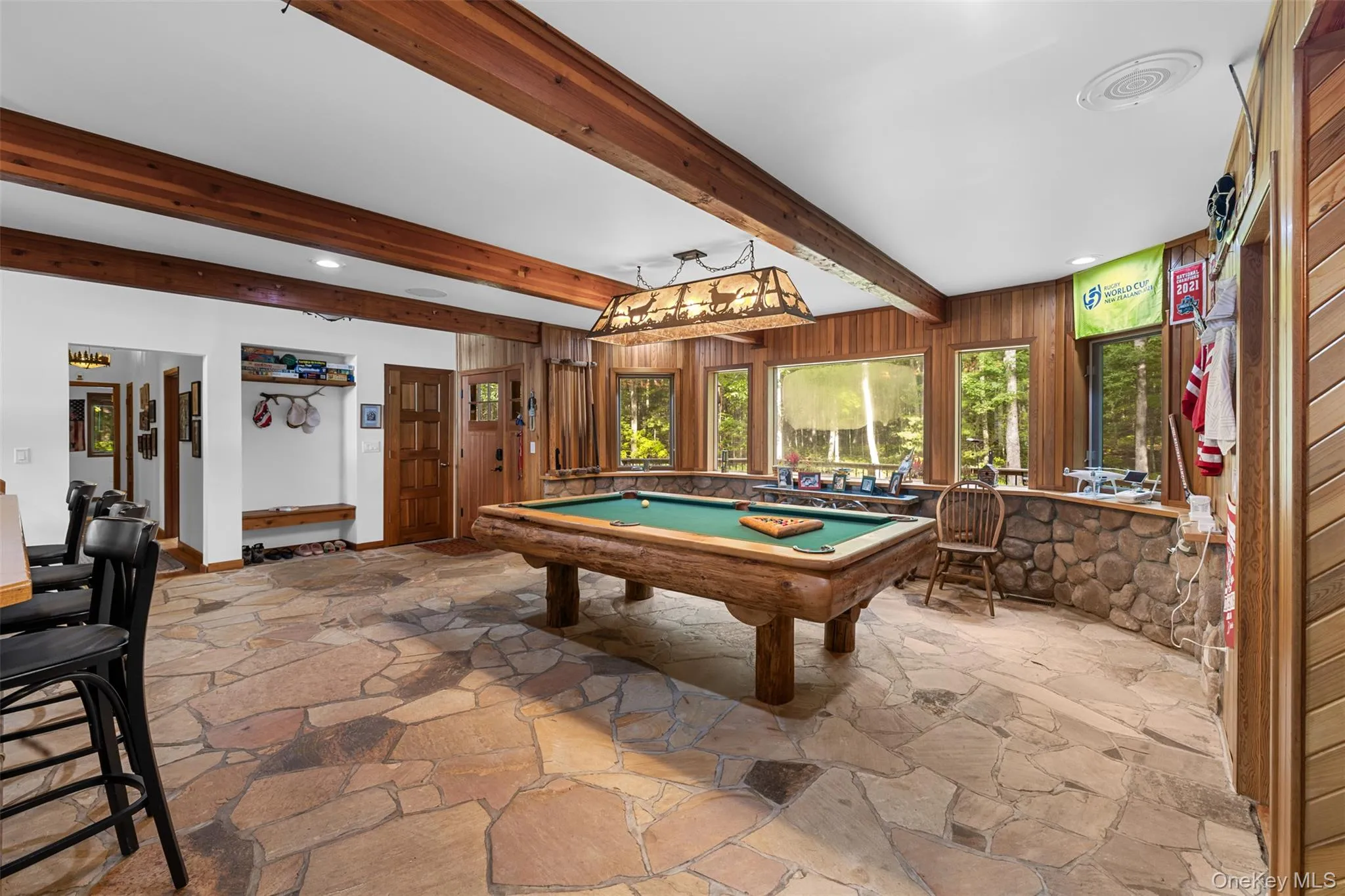 Playroom featuring stone floors, billiards, beamed ceiling, and recessed lighting Playroom featuring stone floors, billiards, beamed ceiling, and recessed lighting