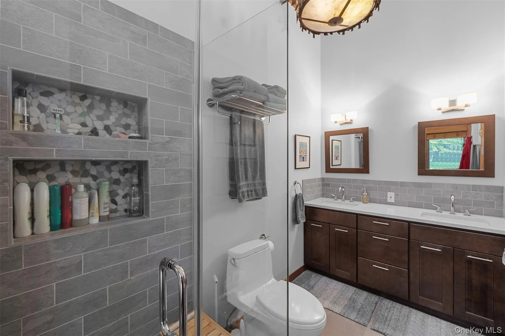 Full bathroom featuring double vanity and backsplash Full bathroom featuring double vanity and backsplash