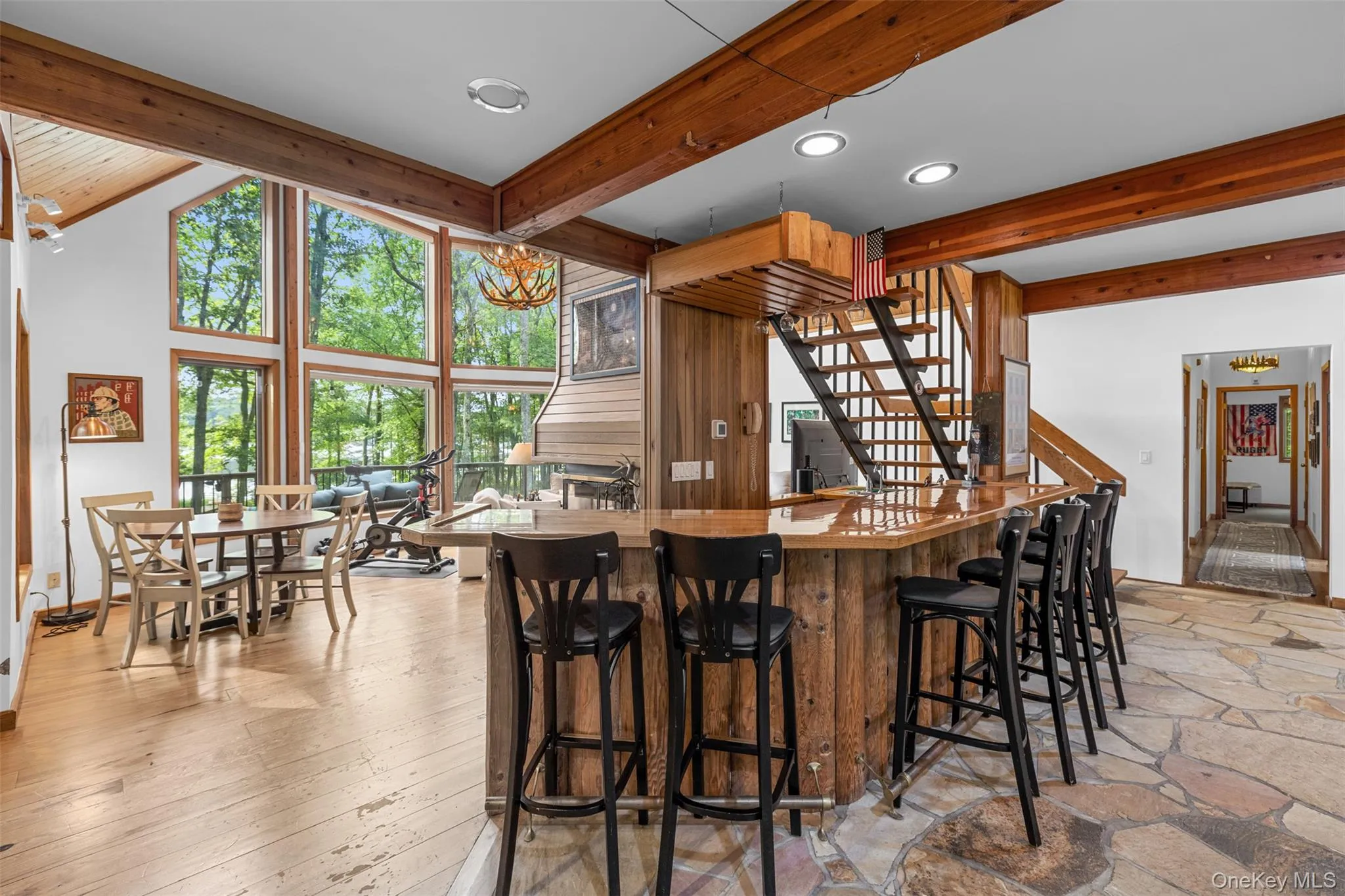 Kitchen featuring beam ceiling, recessed lighting, and a breakfast bar area Kitchen featuring beam ceiling, recessed lighting, and a breakfast bar area