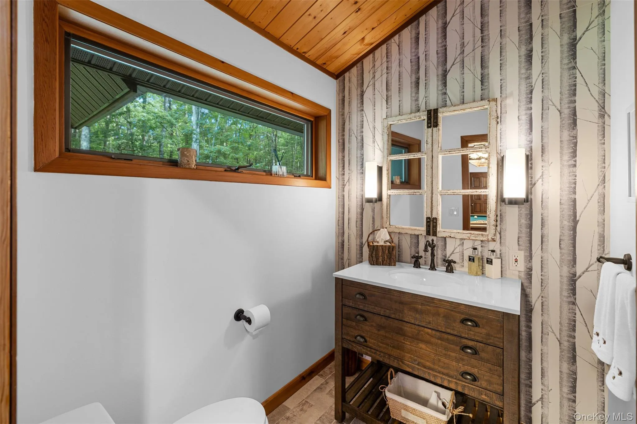 Bathroom with vanity, wooden ceiling, and wood finished floors Bathroom with vanity, wooden ceiling, and wood finished floors
