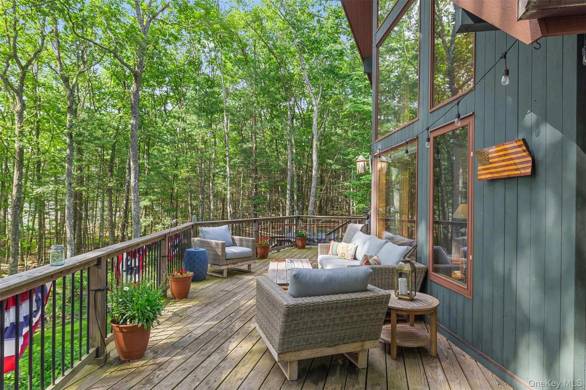 Wooden terrace featuring an outdoor hangout area Wooden terrace featuring an outdoor hangout area