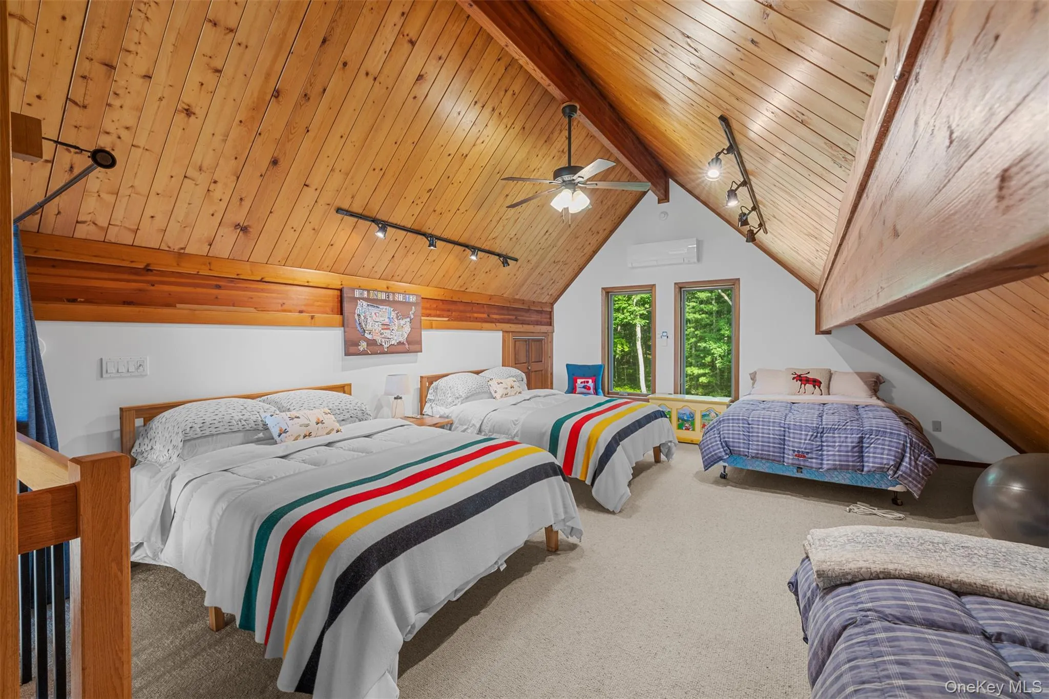 Bedroom with track lighting, carpet, wooden ceiling, and a ceiling fan Bedroom with track lighting, carpet, wooden ceiling, and a ceiling fan