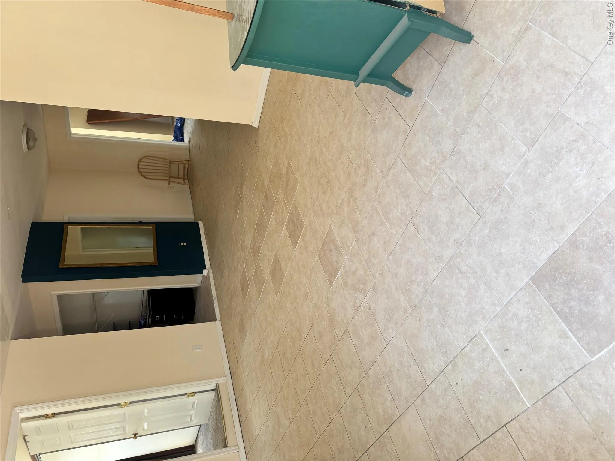 Light-toned tile flooring throughout an open concept area Light-toned tile flooring throughout an open concept area