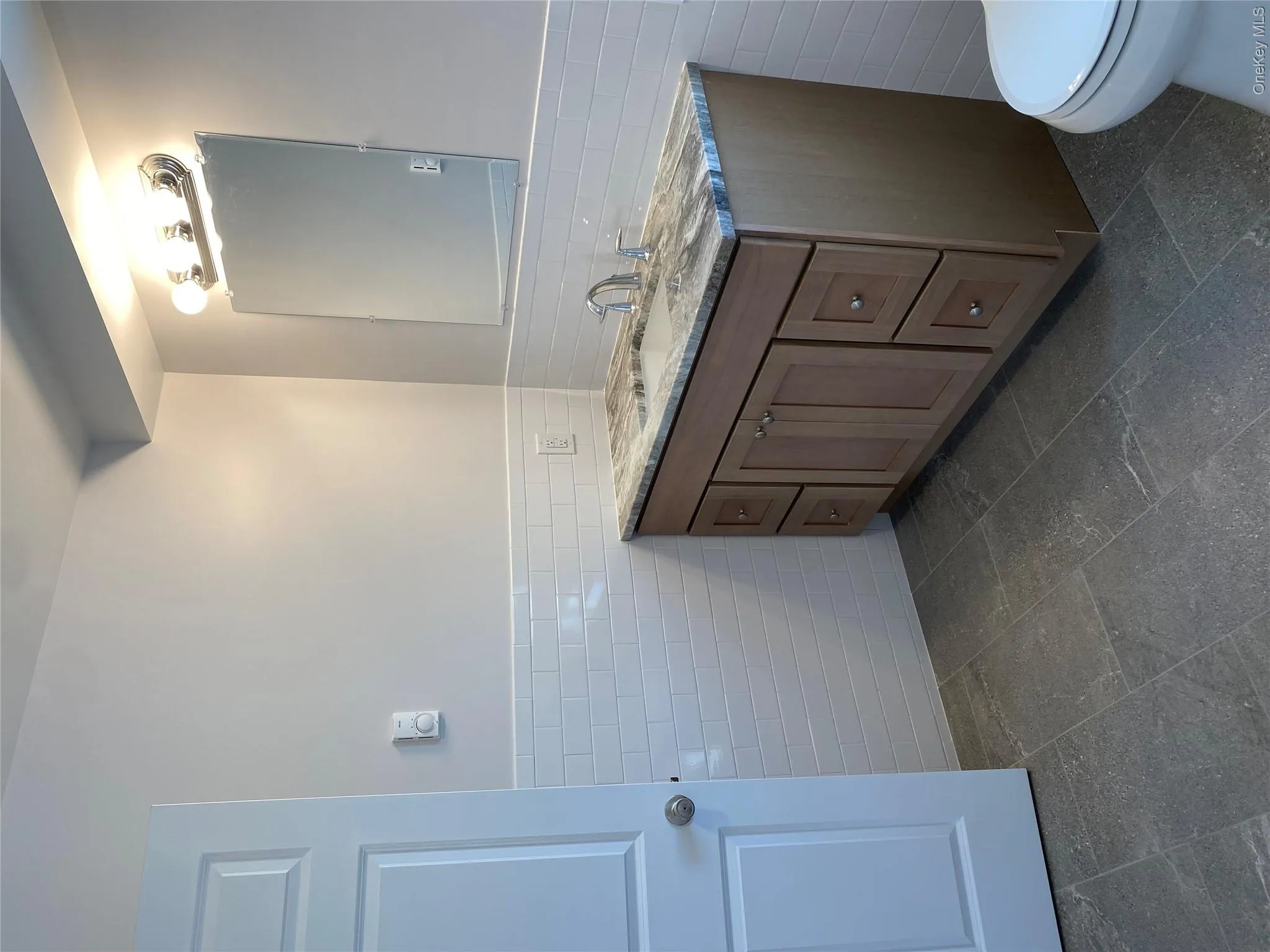 Bathroom with tile walls and vanity Bathroom with tile walls and vanity