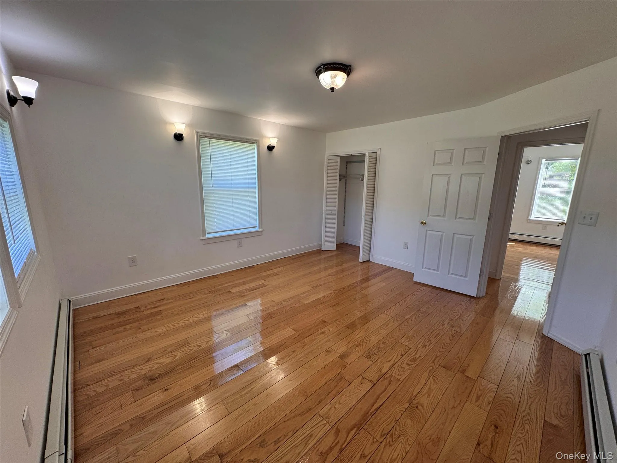 One of two large bedrooms with refinished hardwood floors, closet and lots of light. One of two large bedrooms with refinished hardwood floors, closet and lots of light.