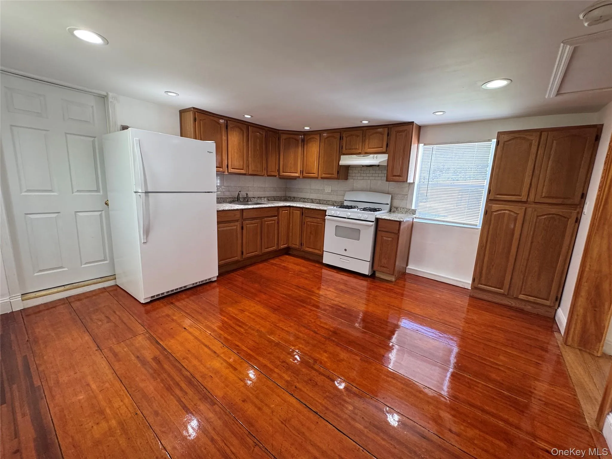 Kitchen/living area with door to the full bath. Kitchen/living area with door to the full bath.