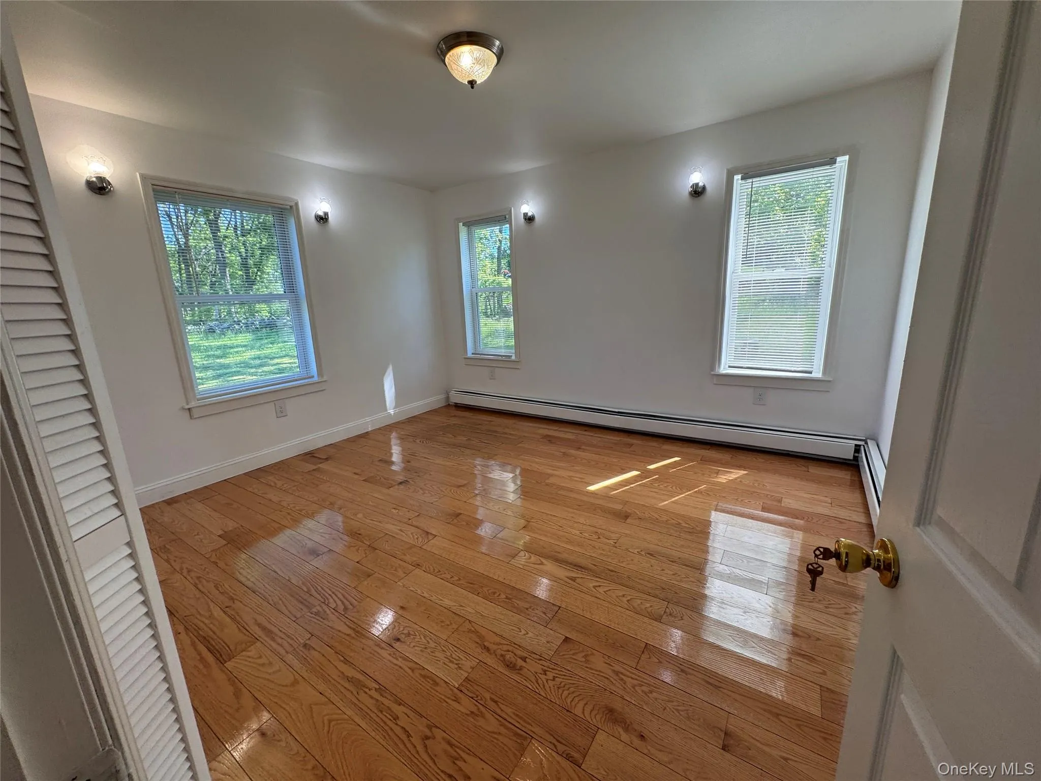 One of two large bedrooms with gleaming hardwood floors, closet and plenty of windows. One of two large bedrooms with gleaming hardwood floors, closet and plenty of windows.