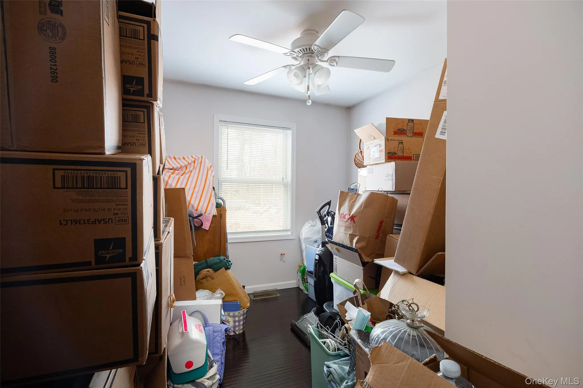 Storage room with a ceiling fan Storage room with a ceiling fan