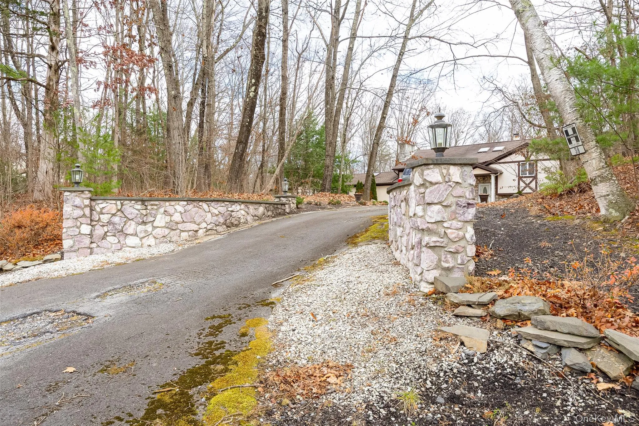 View of asphalt driveway with street lights View of asphalt driveway with street lights