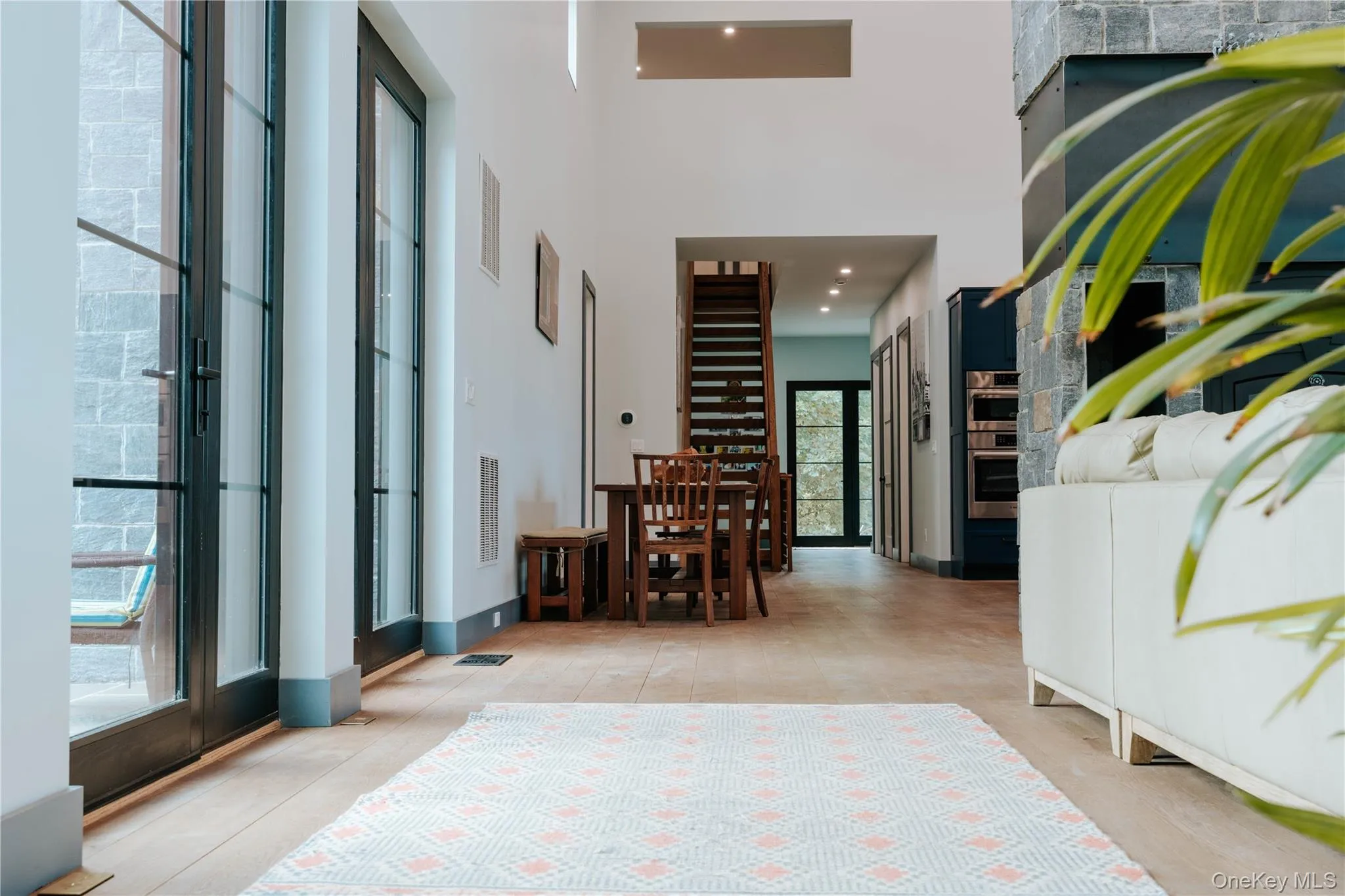 Hallway with a high ceiling and recessed lighting Hallway with a high ceiling and recessed lighting