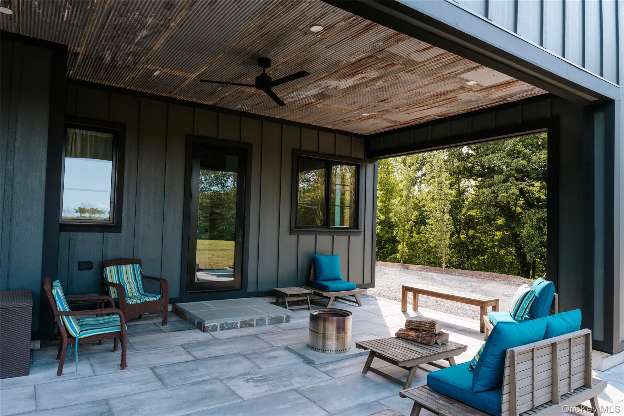View of patio / terrace featuring a ceiling fan and an outdoor living space View of patio / terrace featuring a ceiling fan and an outdoor living space