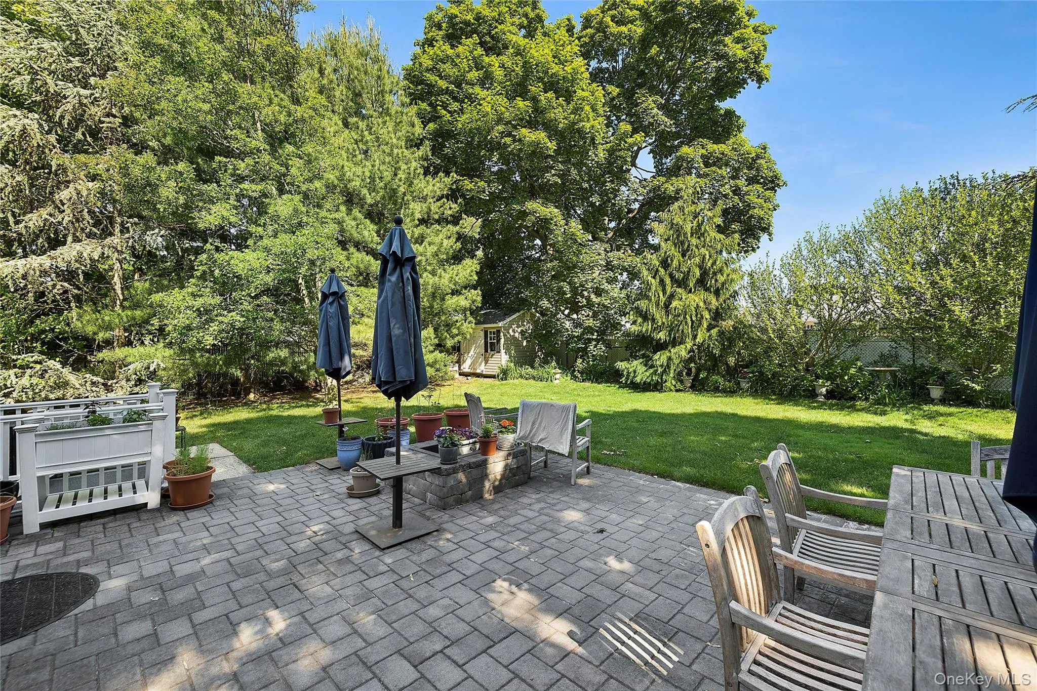 Expansive paver patio offering a spacious outdoor living area Expansive paver patio offering a spacious outdoor living area