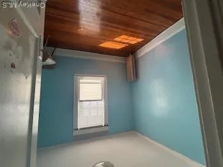 Spare room featuring hardwood / wood-style floors and baseboards Spare room featuring hardwood / wood-style floors and baseboards