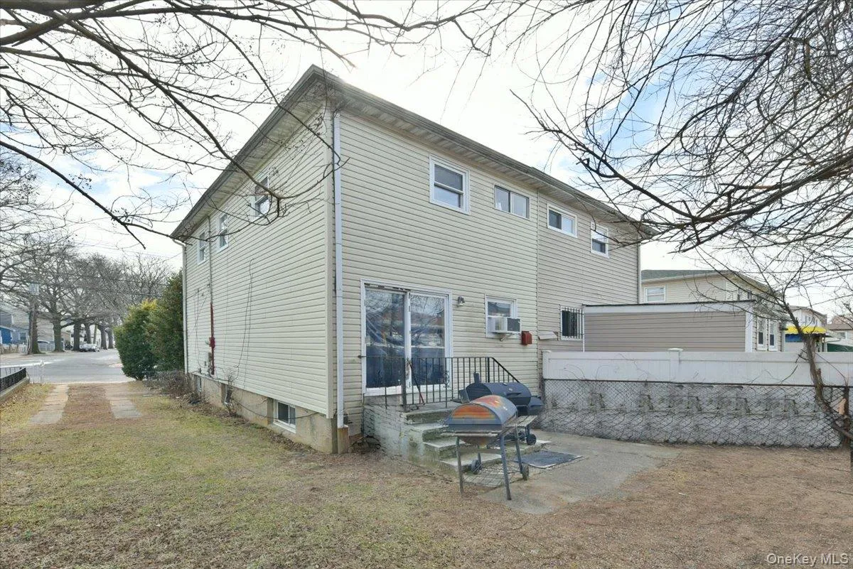 Rear view of property with fence and cooling unit Rear view of property with fence and cooling unit