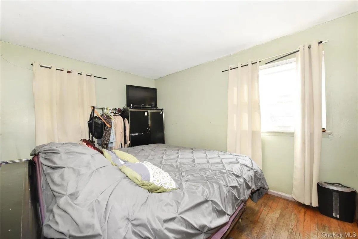 Bedroom featuring hardwood / wood-style flooring Bedroom featuring hardwood / wood-style flooring