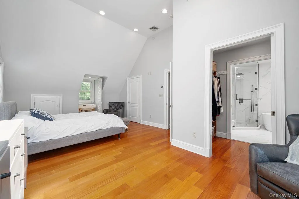 Sun filled Primary Bedroom Suite with lofted ceiling, walk in closet and en suite bathroom. Sun filled Primary Bedroom Suite with lofted ceiling, walk in closet and en suite bathroom.