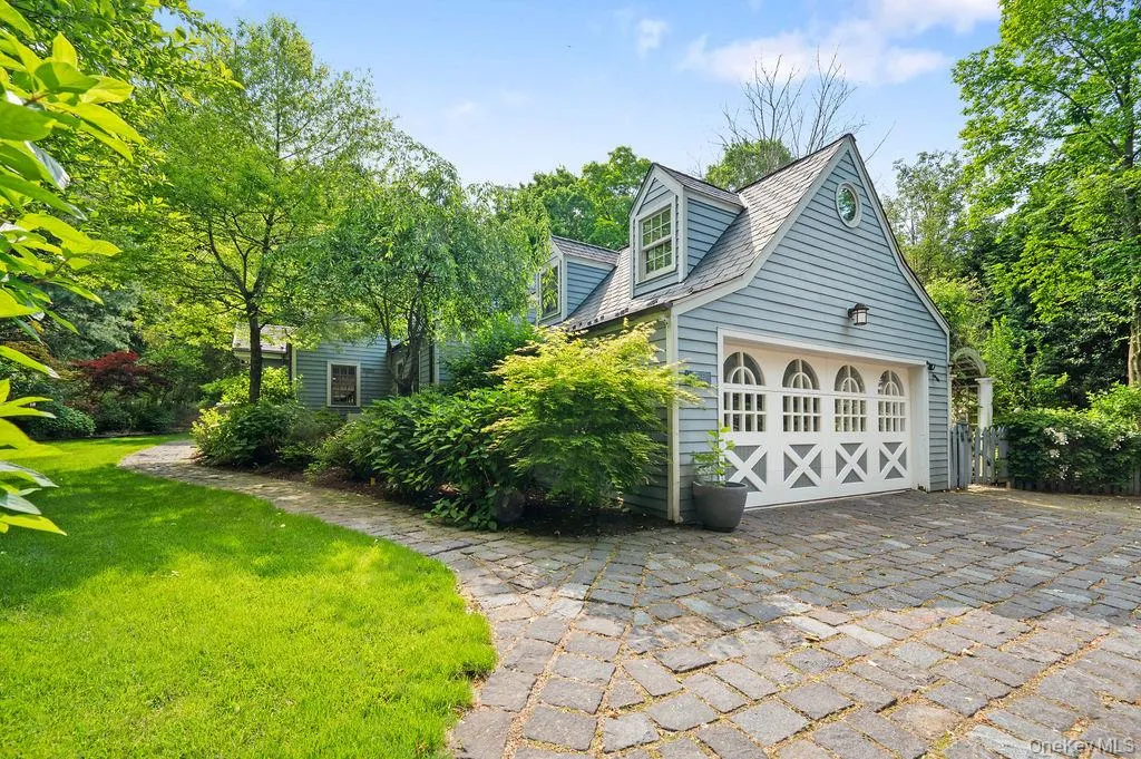 Two car garage with oversized driveway, fits several cars. Two car garage with oversized driveway, fits several cars.