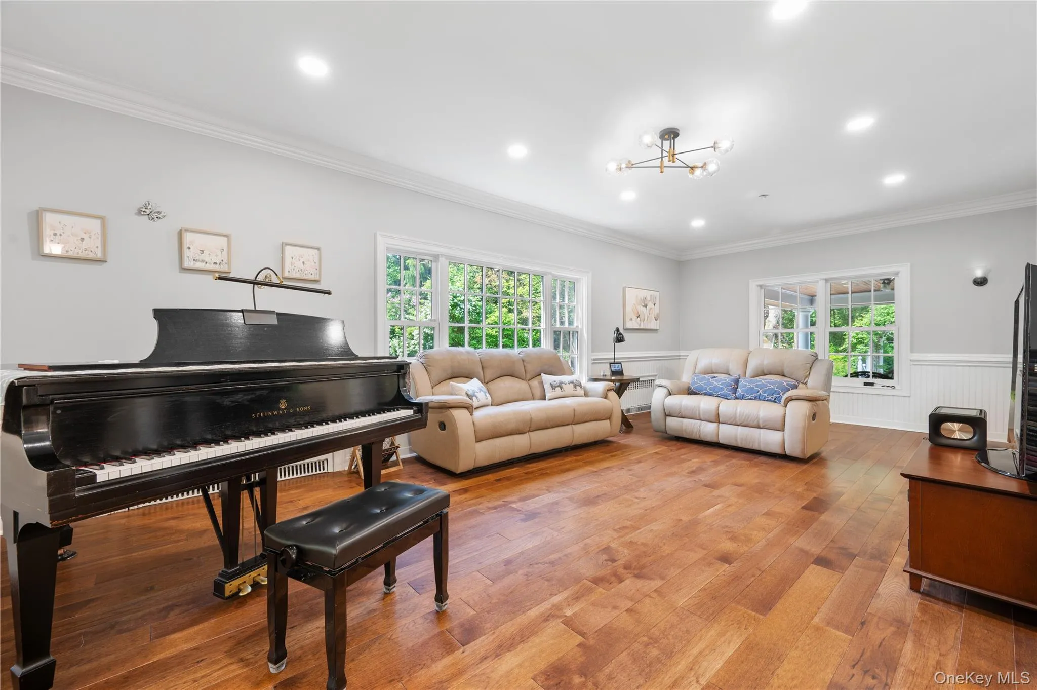 Spacious Family Room stretches across the entire back of the home, surrounded by windows on every side. Spacious Family Room stretches across the entire back of the home, surrounded by windows on every side.