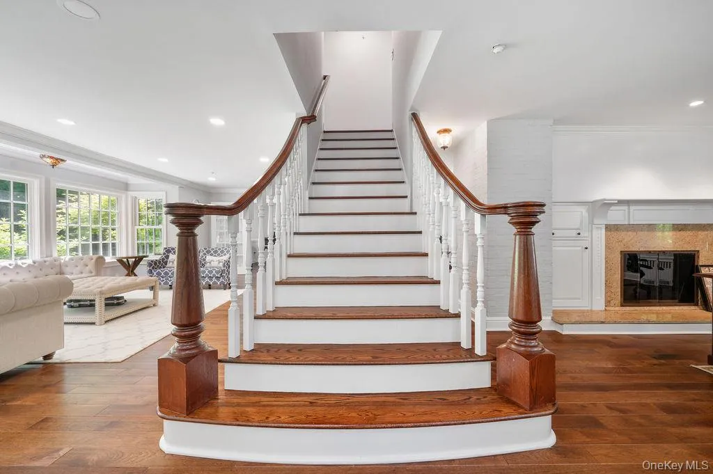 Foyer with majestic staircase and a light filled open floor plan. Foyer with majestic staircase and a light filled open floor plan.