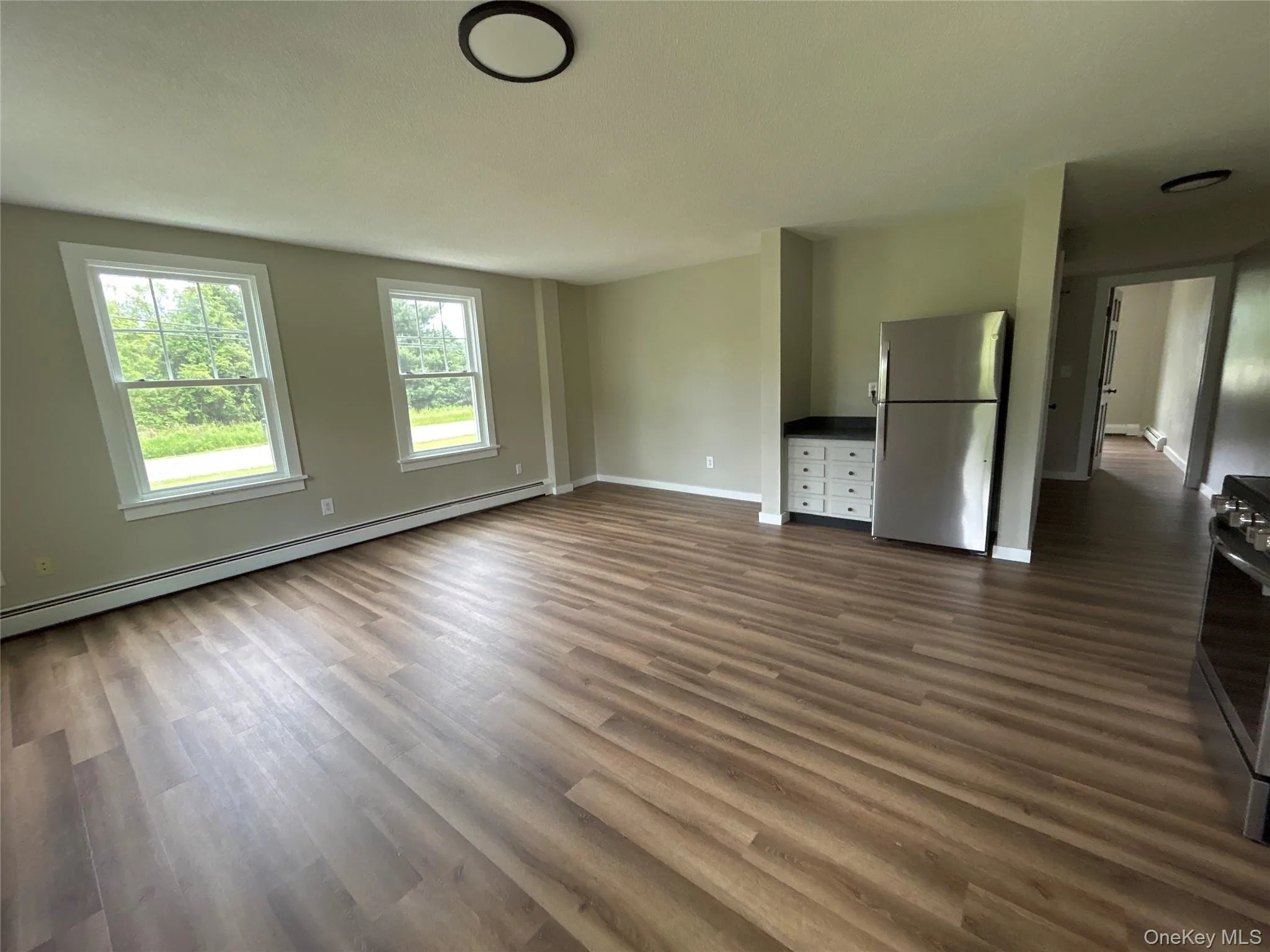 First floor #2 apartment open concept view from kitchen into dining room and living room First floor #2 apartment open concept view from kitchen into dining room and living room