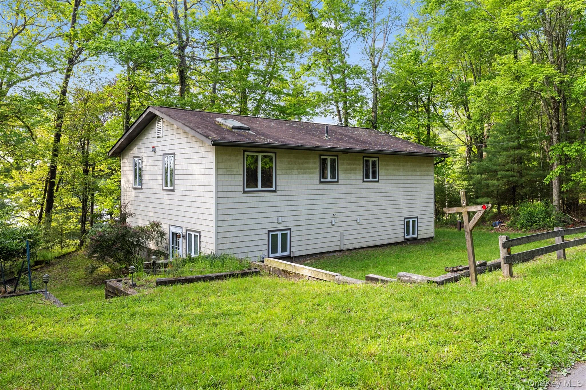 Rear view of property with a lawn Rear view of property with a lawn