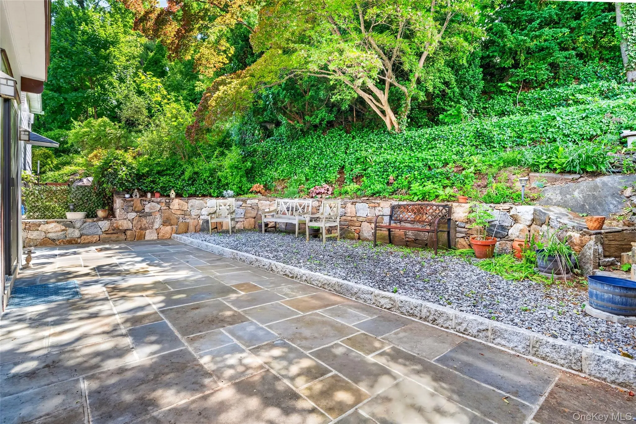 Expansive stone patio featuring large flagstone pavers Expansive stone patio featuring large flagstone pavers