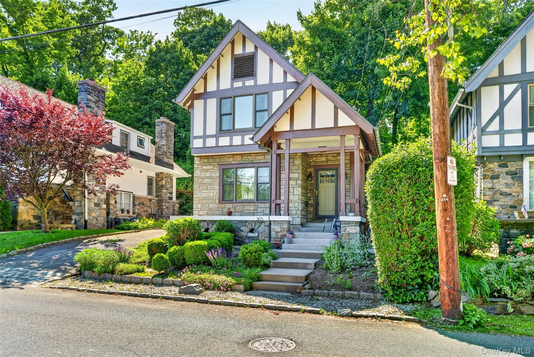 Tudor-style exterior with stone and half-timbered finishes Tudor-style exterior with stone and half-timbered finishes