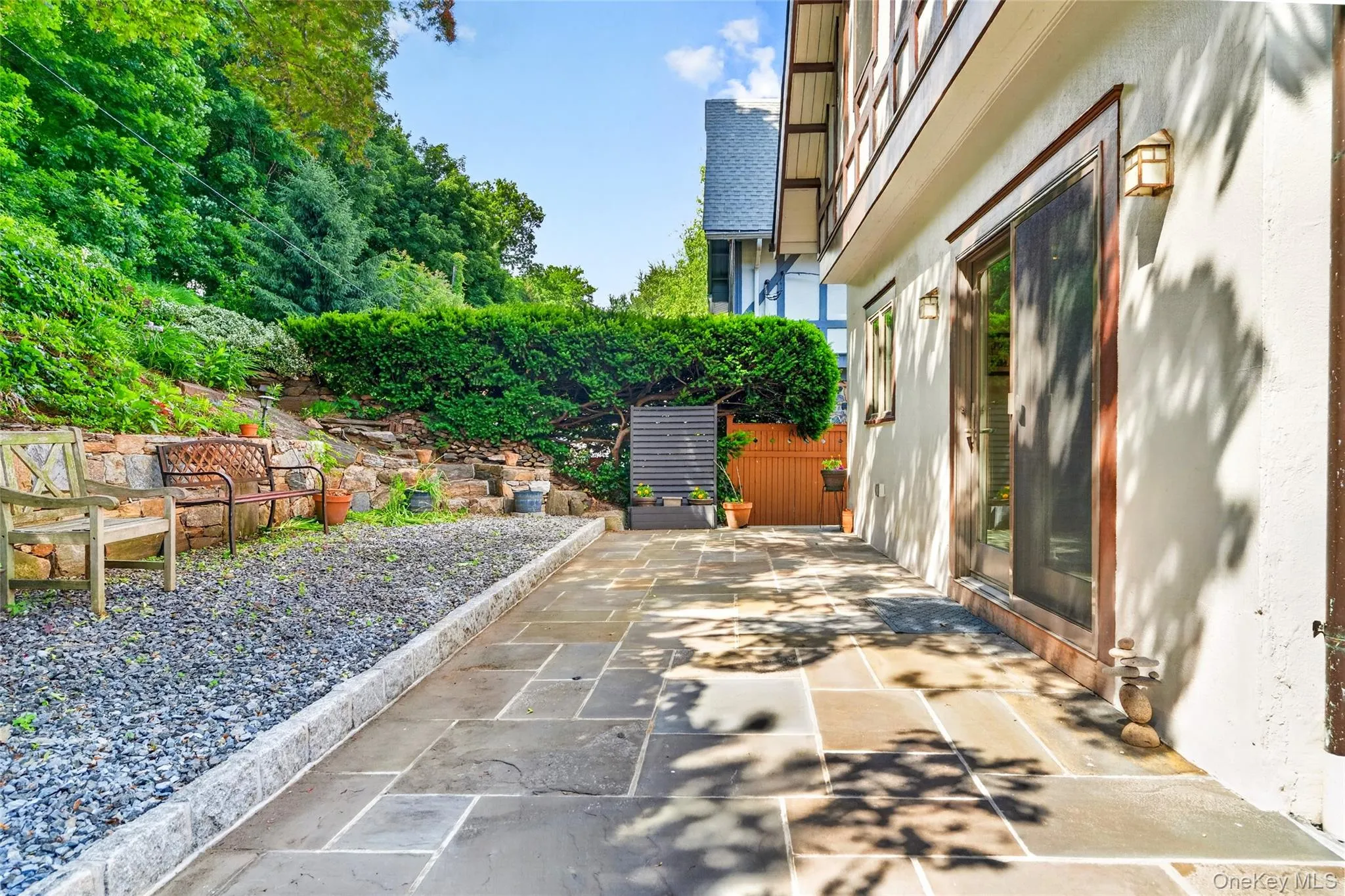 Expansive stone patio with flagstone pavers Expansive stone patio with flagstone pavers