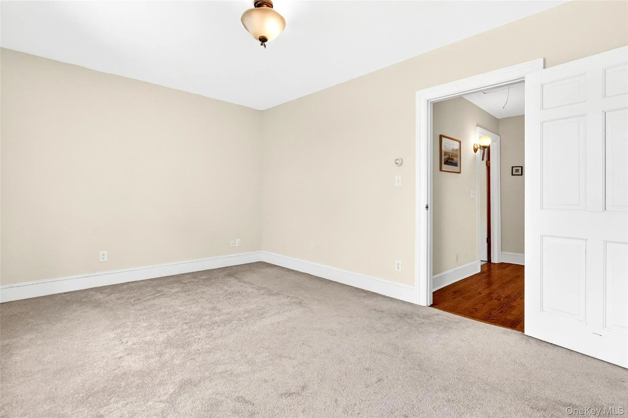 Neutral-toned walls and plush carpeting Neutral-toned walls and plush carpeting