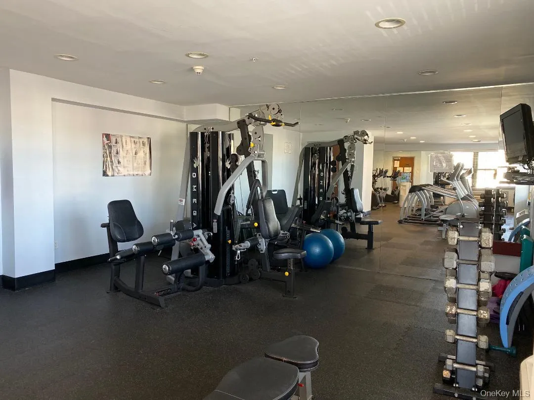 Workout area featuring recessed lighting and baseboards Workout area featuring recessed lighting and baseboards