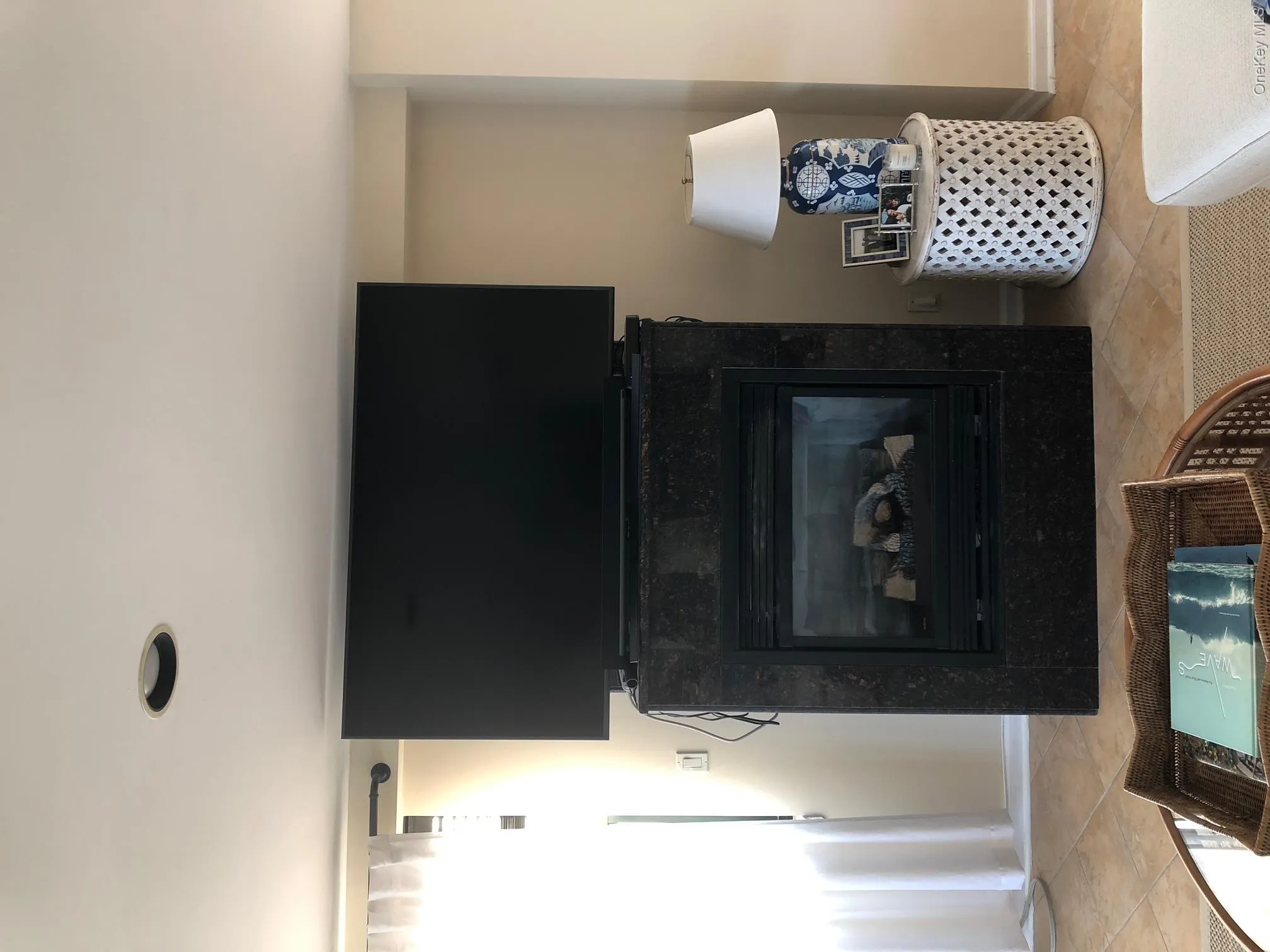 Room details featuring a premium fireplace and baseboards Room details featuring a premium fireplace and baseboards