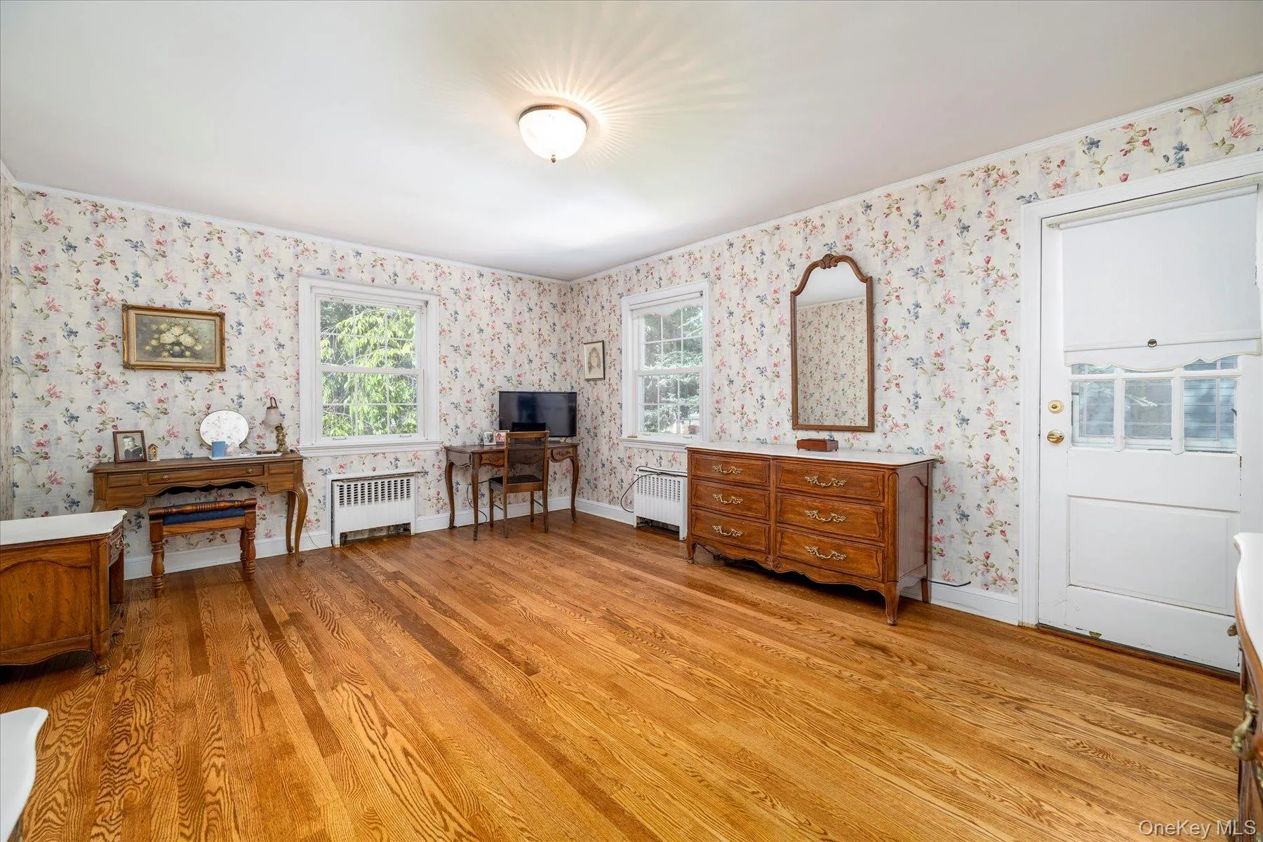 Primary Bedroom features wood floors, walk-in closet and door to outside deck. Primary Bedroom features wood floors, walk-in closet and door to outside deck.