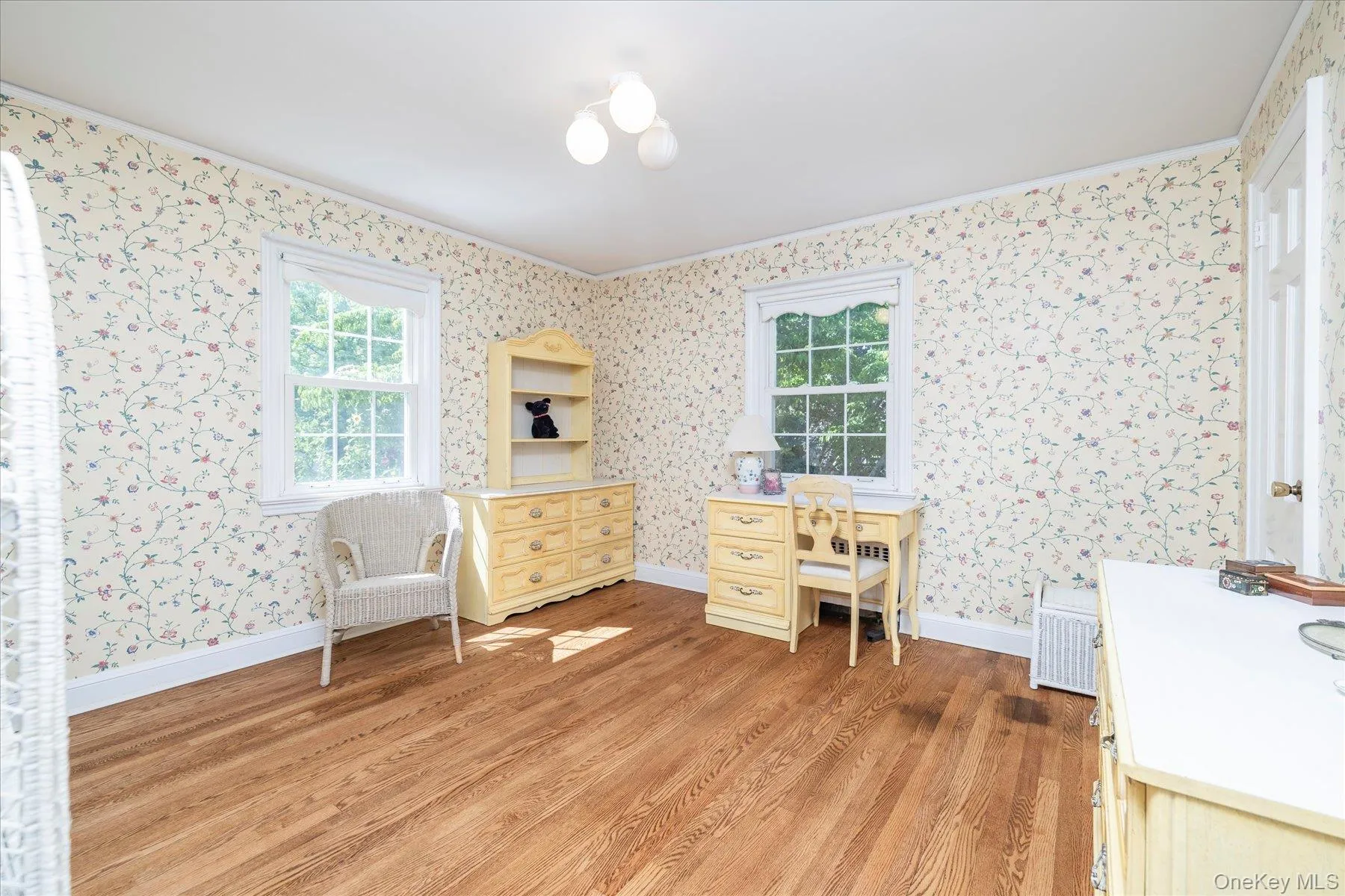 Second bedroom also features wood floors and is light and airy. Second bedroom also features wood floors and is light and airy.